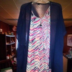 No brand can't read it. Size guessing a 8-10? Medium with cape 2 piece set